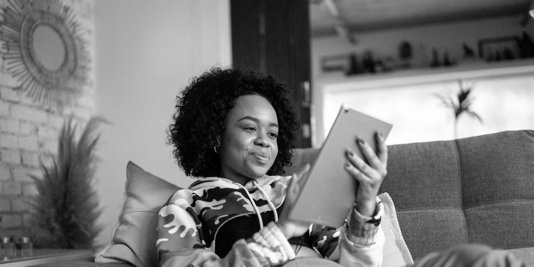 Person reviewing financial documents with calculator and charts showing budget planning progress